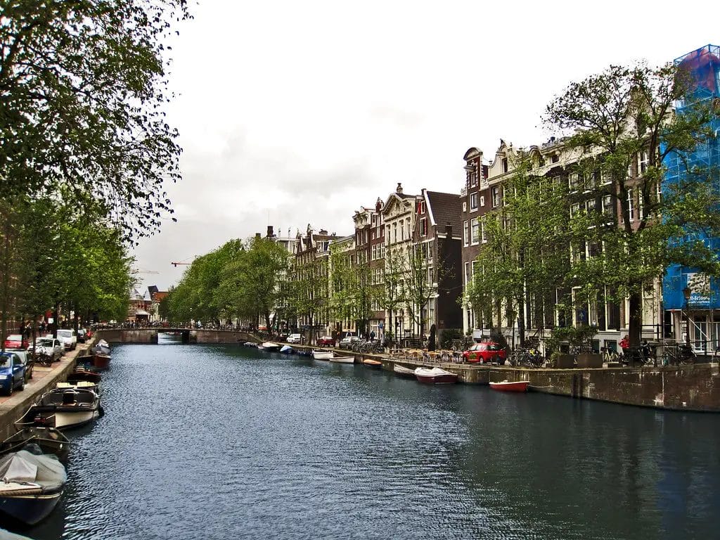 a canal with boats and buildings