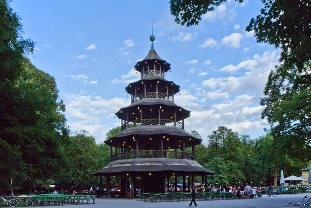 a pagoda with people around it with Leifeng Pagoda in the background
